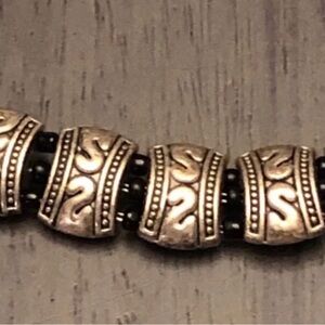 Bracelet with metal tribal spacers black metal bead accents